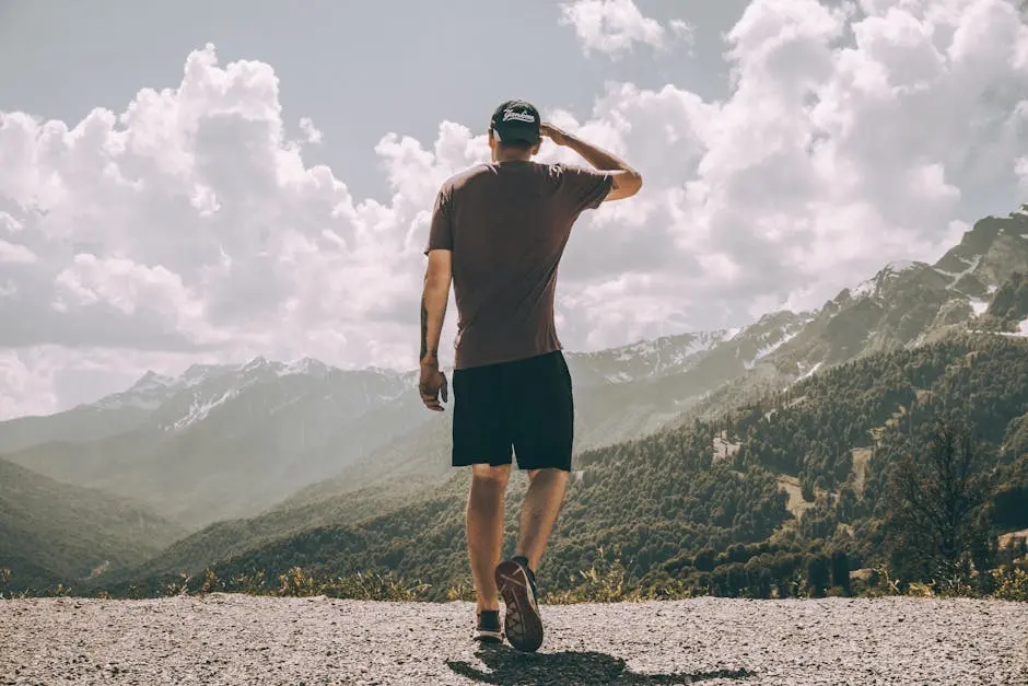 Photo Of Man On Top Of The Mountain