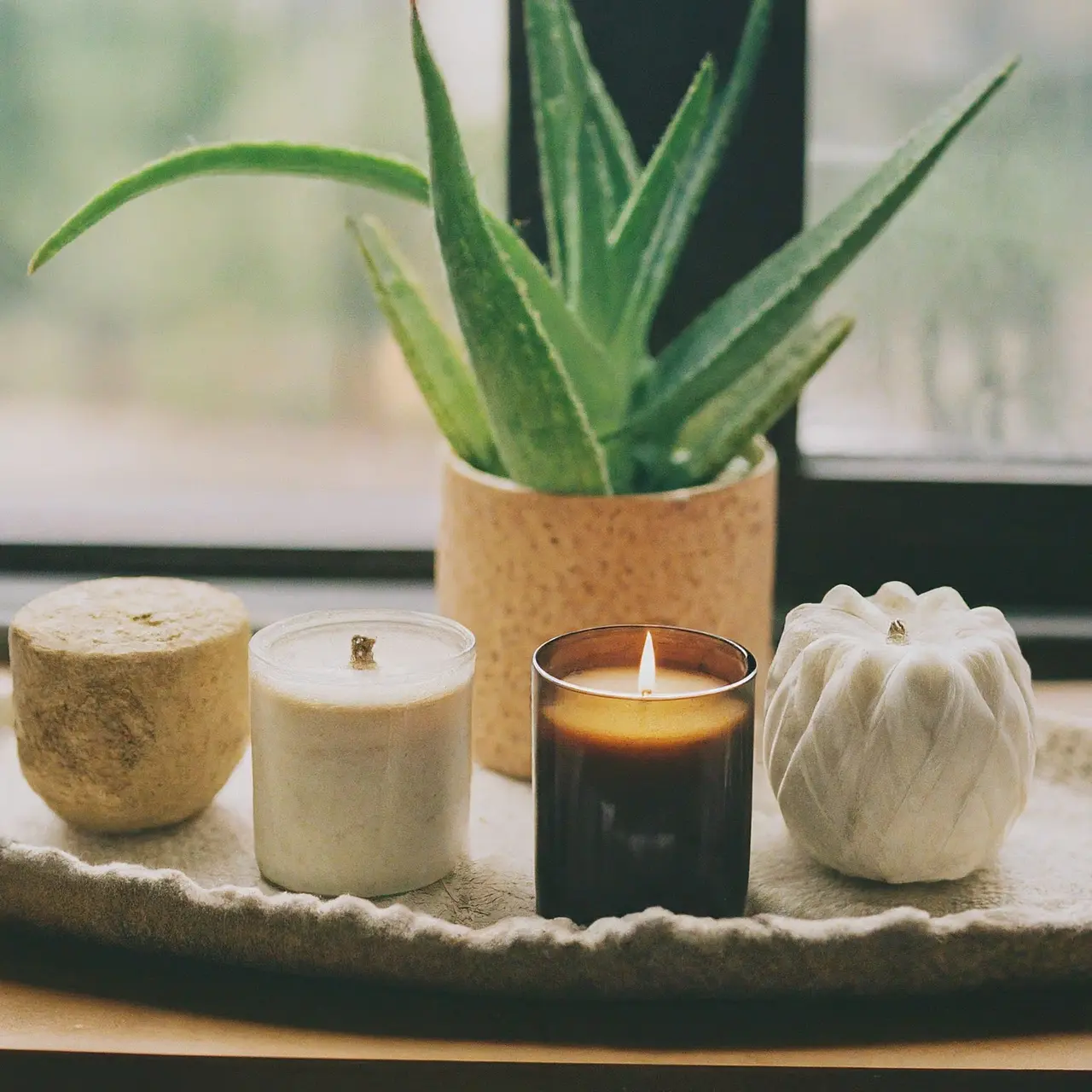 A variety of designer candles on a stylish shelf. 35mm stock photo