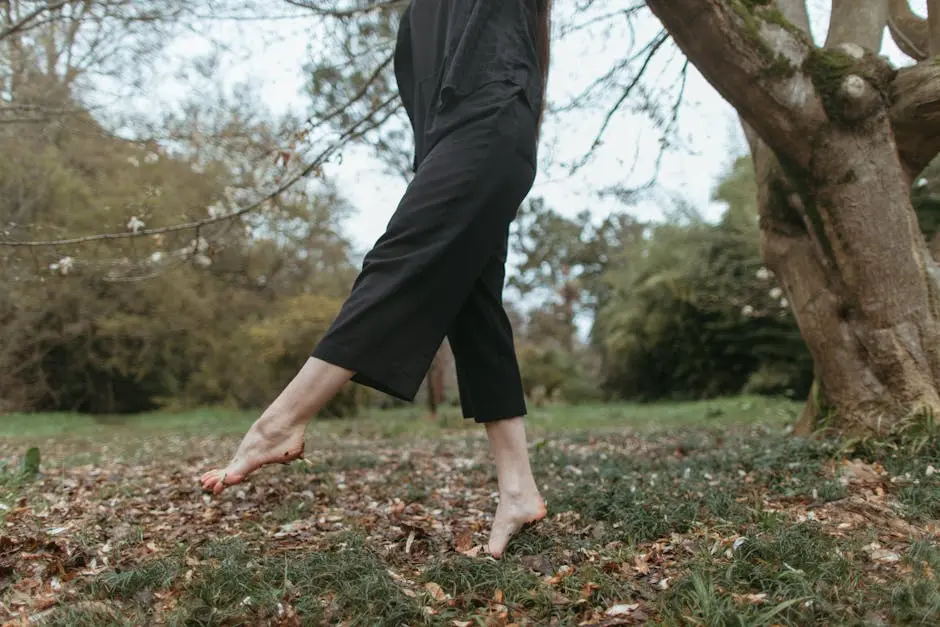 Person walking barefoot in nature, highlighting freedom and connection with the earth.