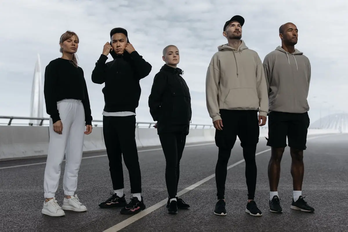 Stylish People Wearing Activewear Standing on the Road where they can include a pistol bag with style