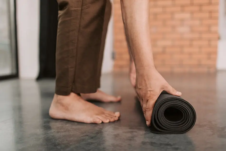 A Person Holding a Rolled Yoga Mat