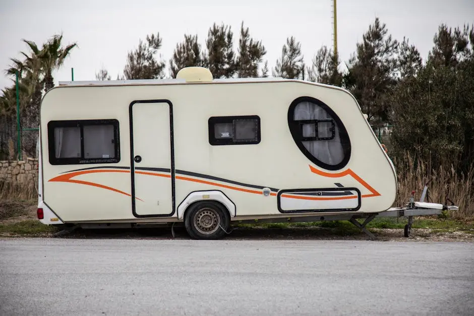 A modern caravan parked outdoors, perfect for travel adventures.