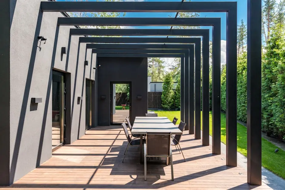 Contemporary patio featuring an elegant pergola structure and outdoor dining set.