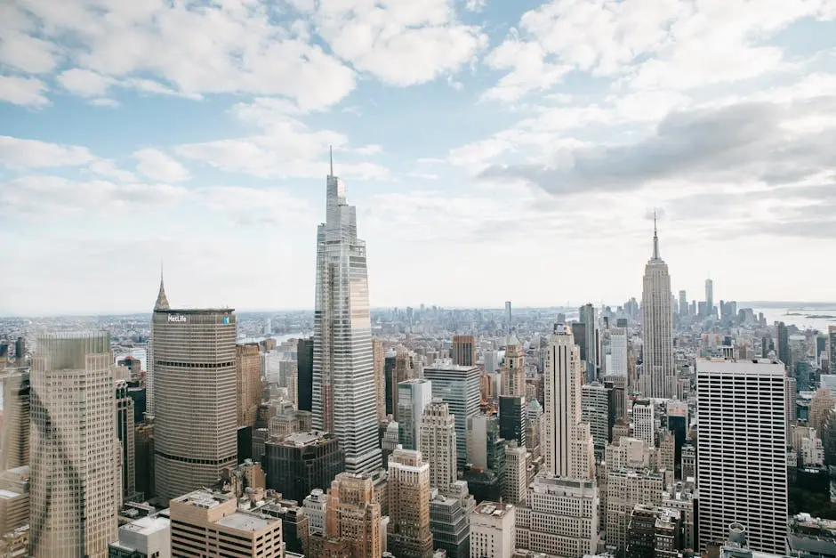 High rise skyscrapers with modern empire state building located against cloudy sky in center of New York city in Manhattan