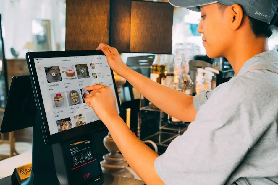 Restaurant Worker Making Order with Use of Touchscreen