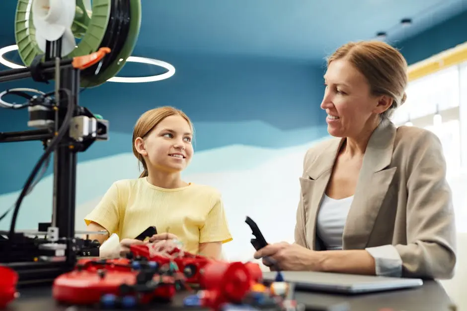 A young girl and a teacher engaging in a STEM project using a 3D printer. Indoors and cheerful.