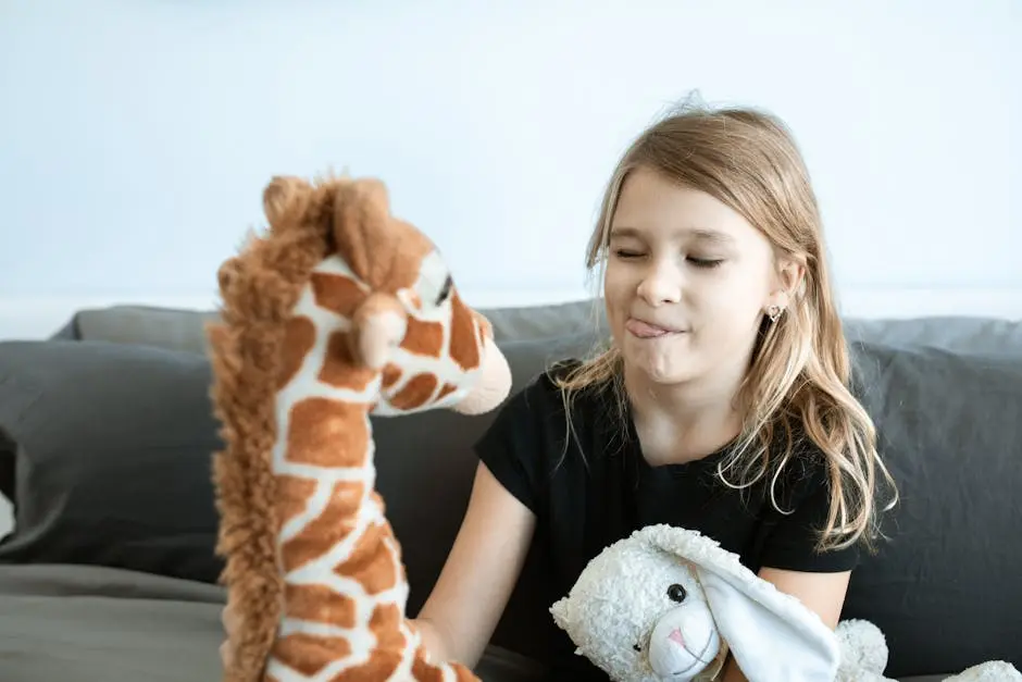 Girl in Black T-shirt Holding Brown and White Giraffe Plush Toy