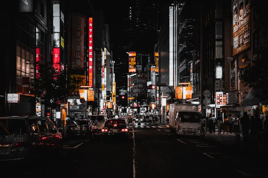 Experience the vibrant nightlife of Tokyo’s bustling streets with illuminated signs and pedestrians.