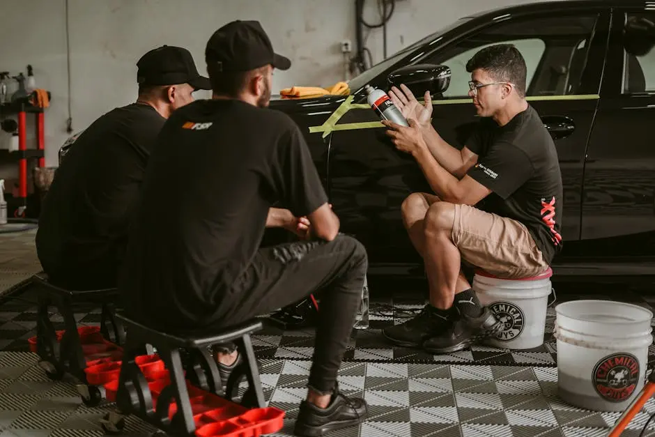 Men Working with Car Tuning in Garage