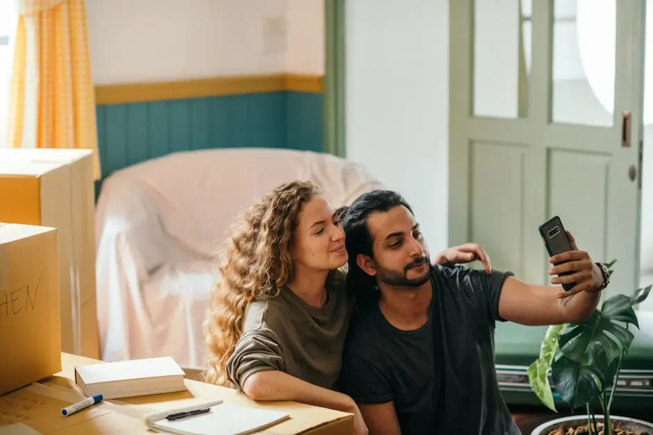 Cheerful young couple taking selfie with smartphone while moving