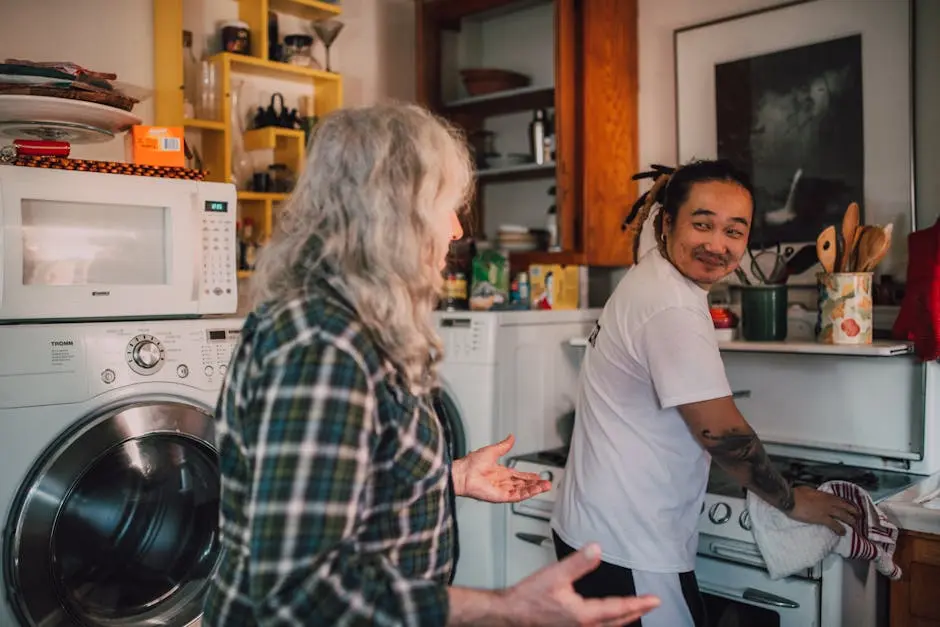 A touching moment in a cozy kitchen between a senior and a caregiver, showcasing warmth and care.