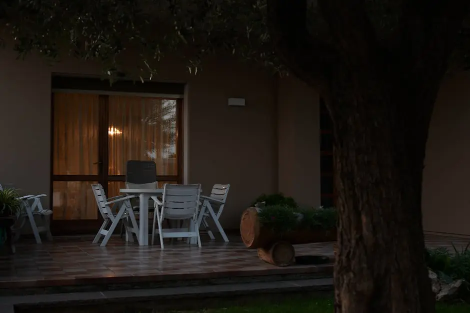 White Chairs and Table on a Patio