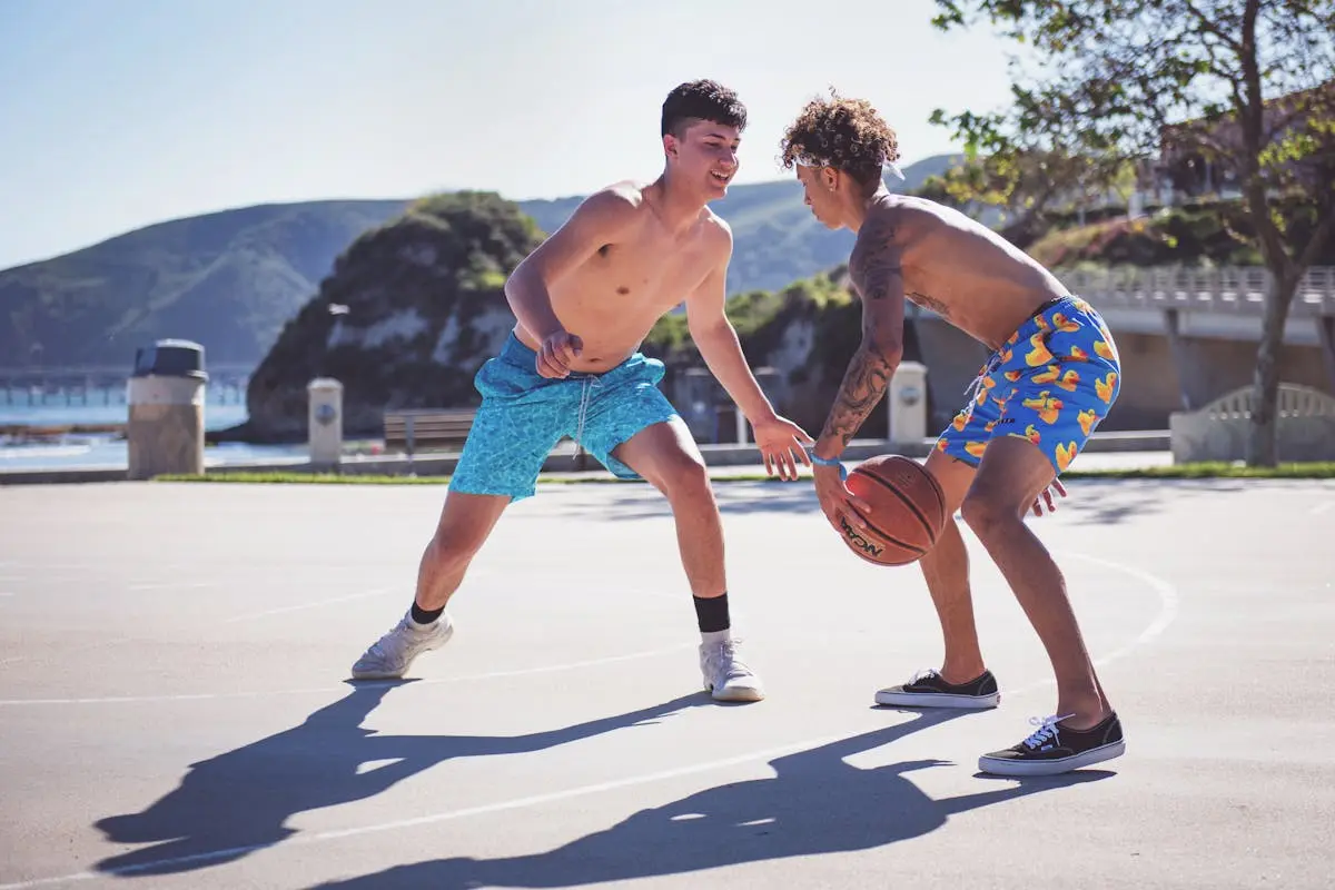 Photo Of Two Men Playing Basketball